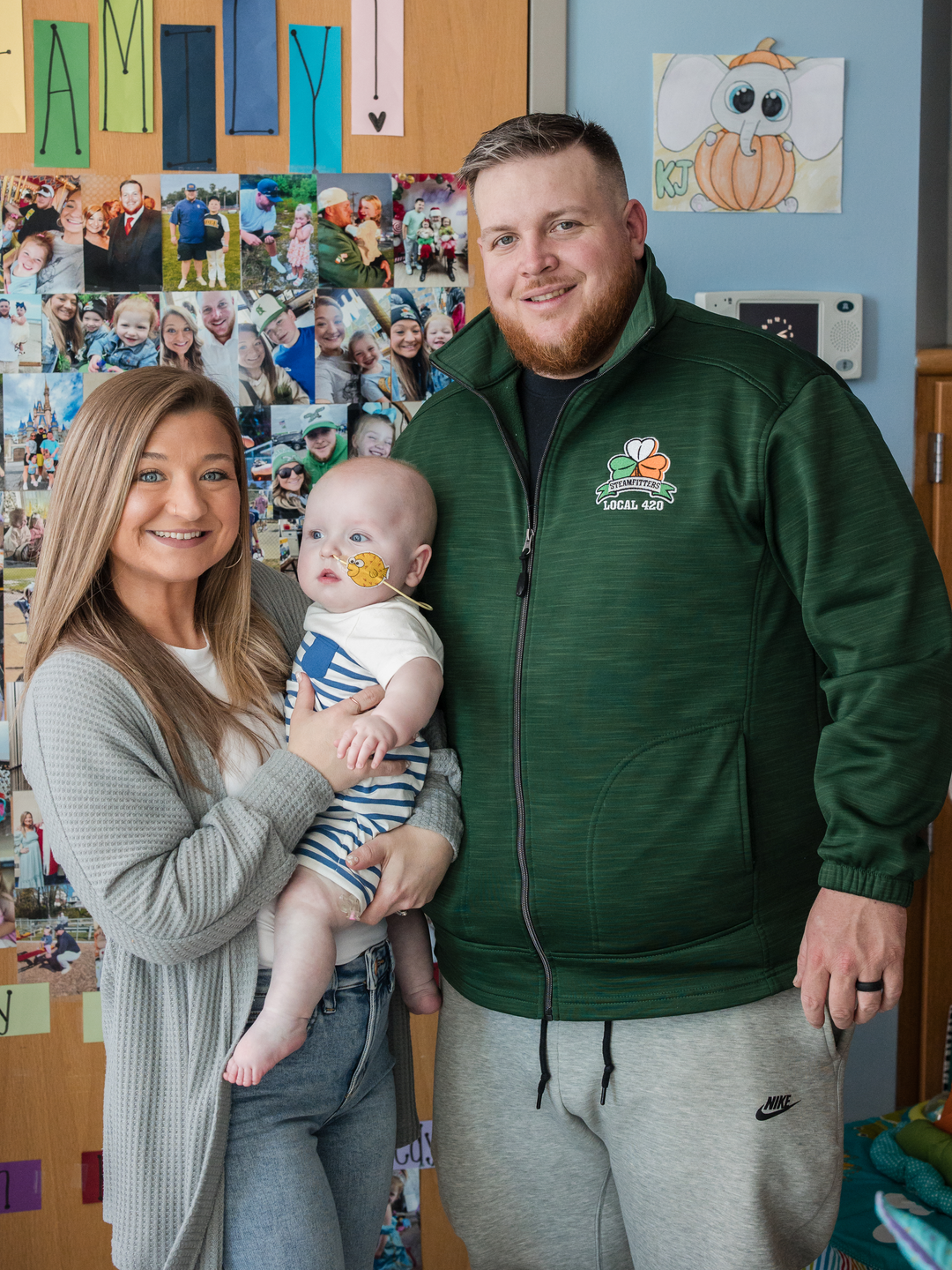 Nicole Muldoon holds baby KJ, beside Kyle Muldoon, in a children's hospital room