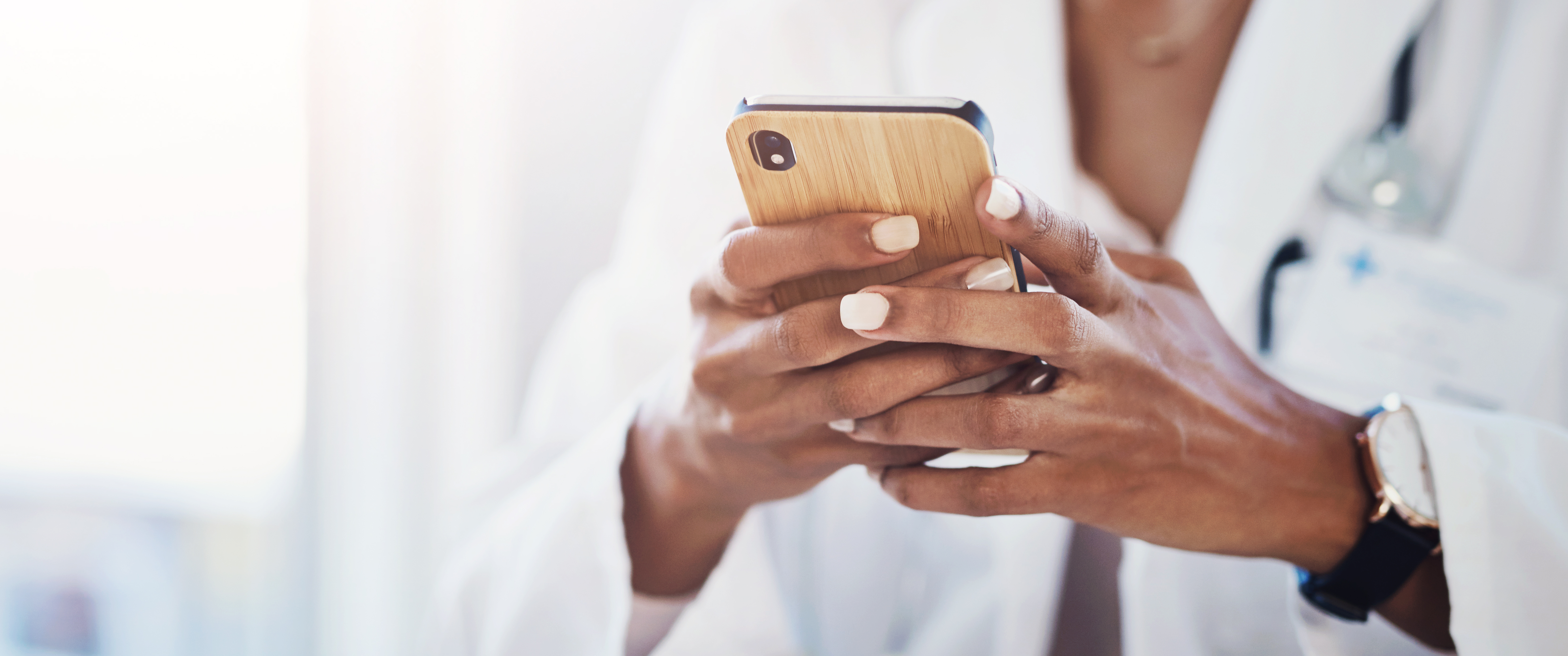 Close up of doctor holding phone