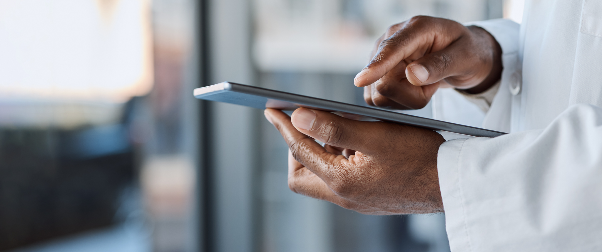 Closeup of medical worker holding tablet