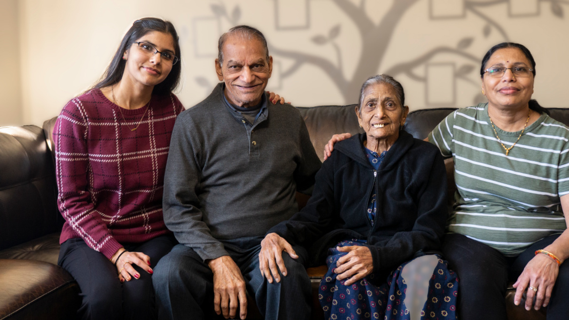 Vilma Patel sitting with her children and granddaughter
