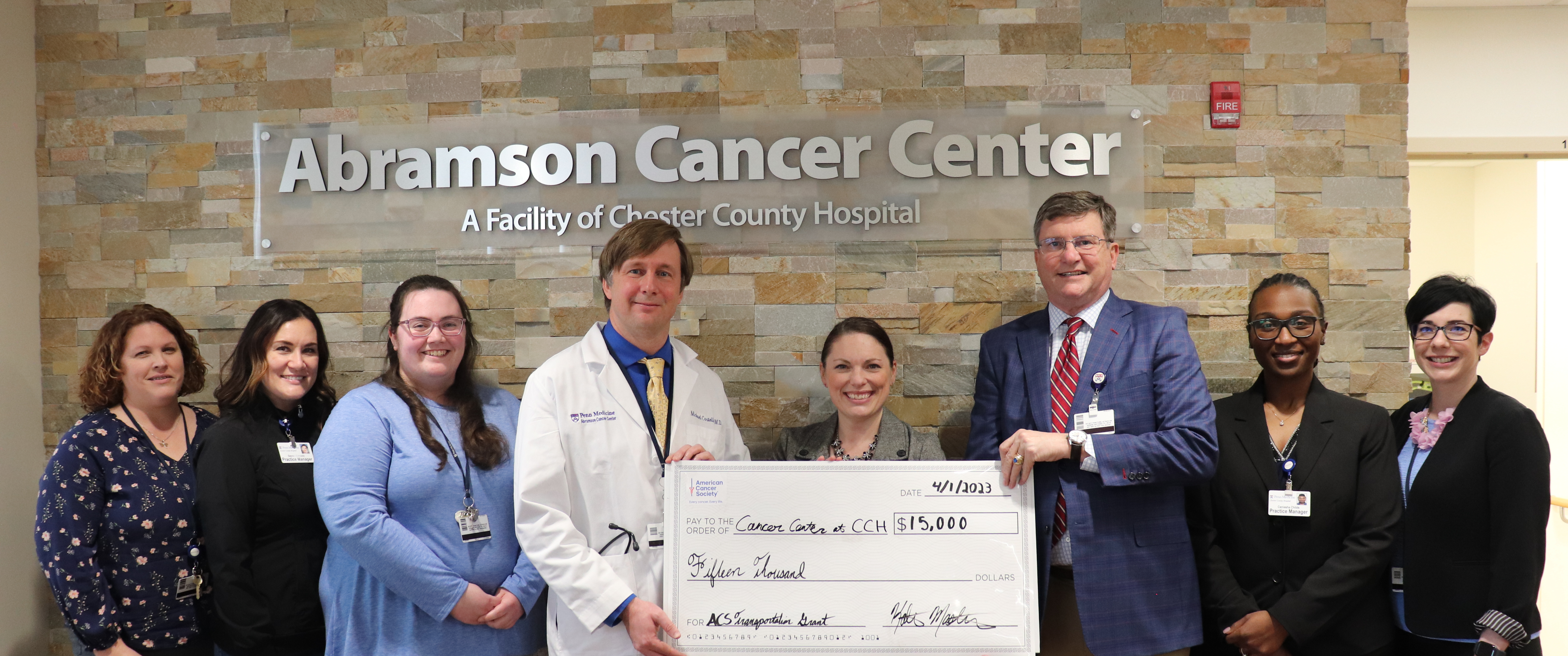 Michael Duncan presents a check from the American Cancer Society to staff from The Abramson Cancer Center at Chester County Hospital
