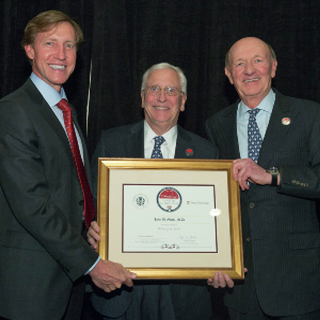J. Larry Jameson, John Glick, and Ralph Muller, with a certificate
