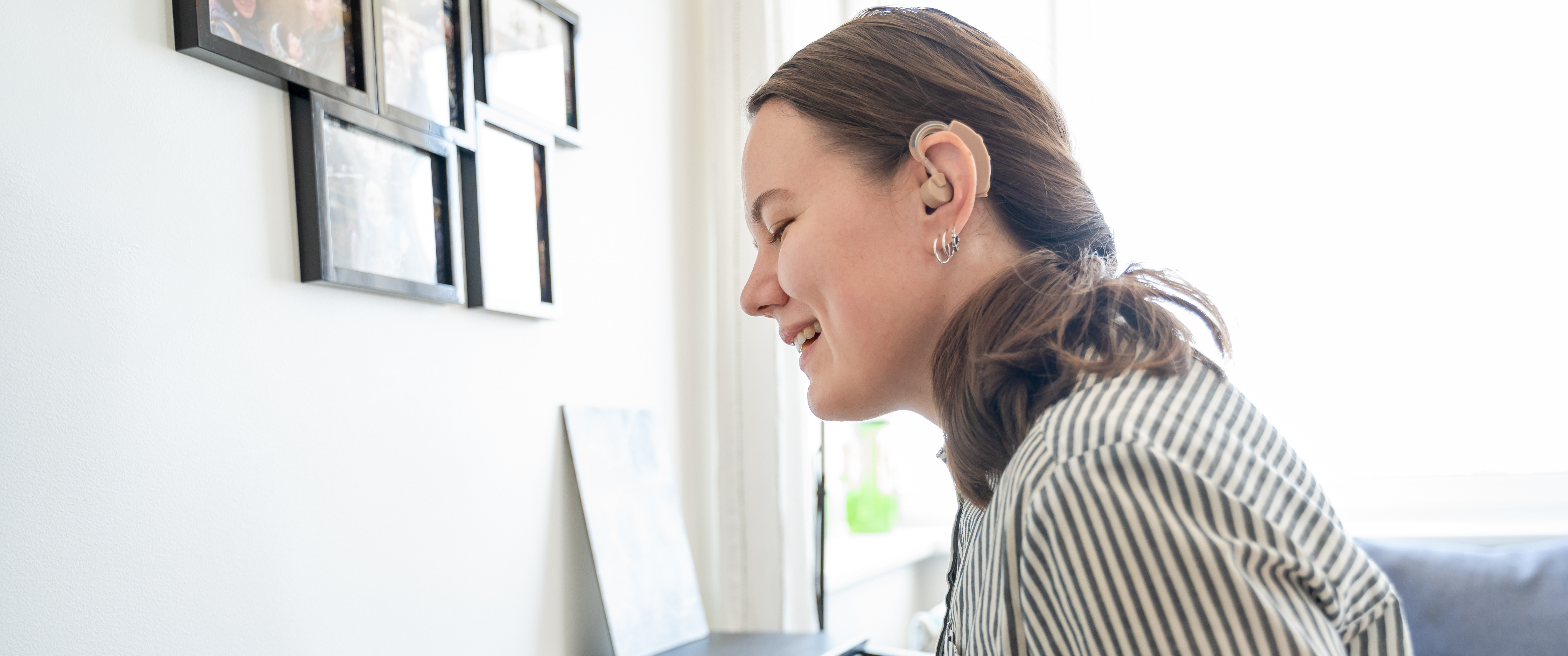 Musician with hearing aid playing piano