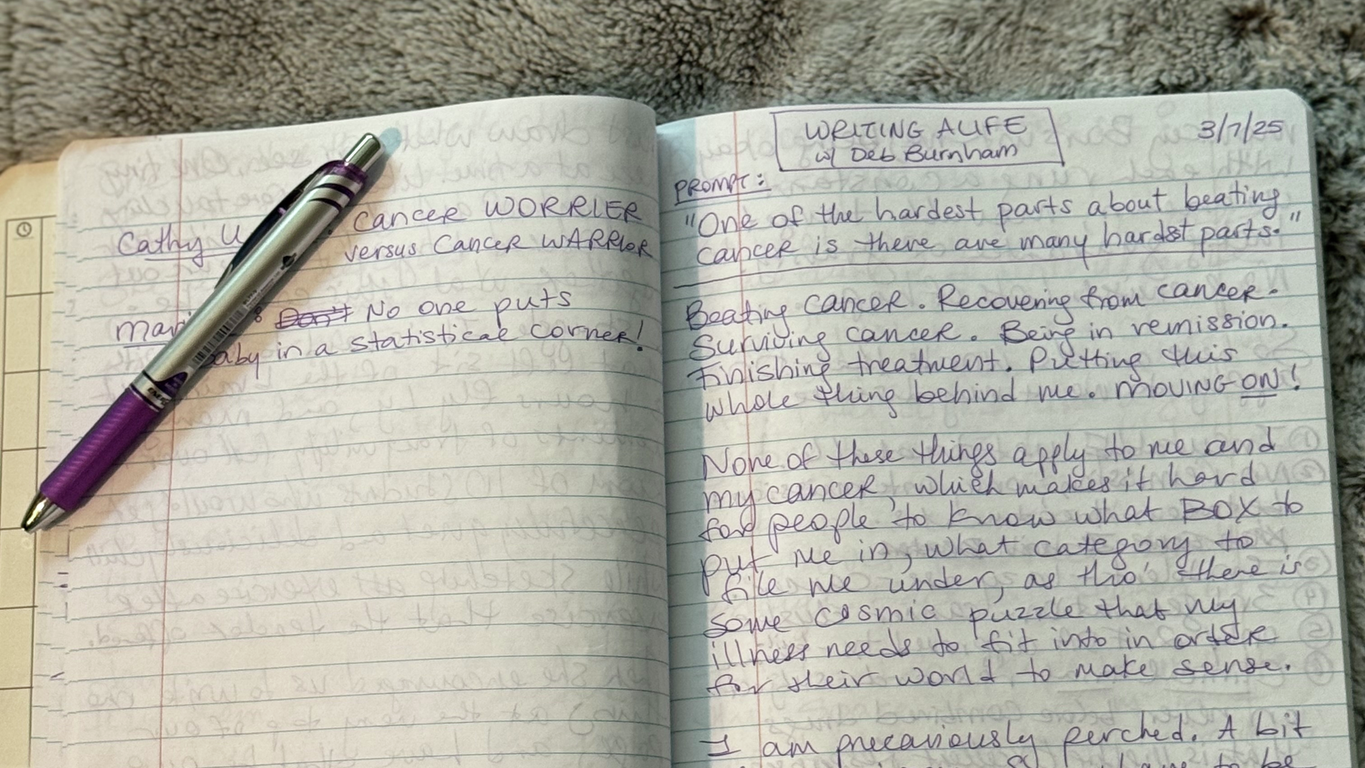 An open journal notebook shows the beginning of a Writing a Life essay