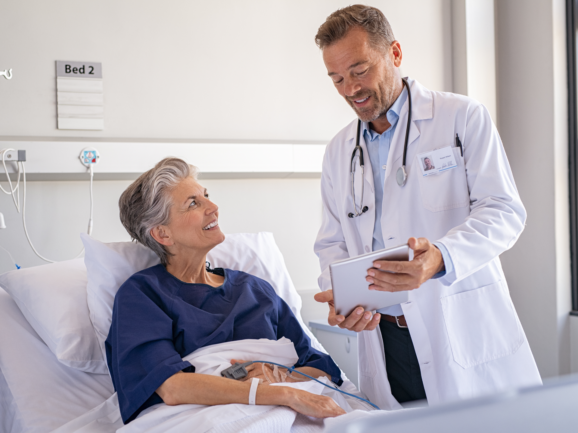 Inpatient care doctor discussing results with patient