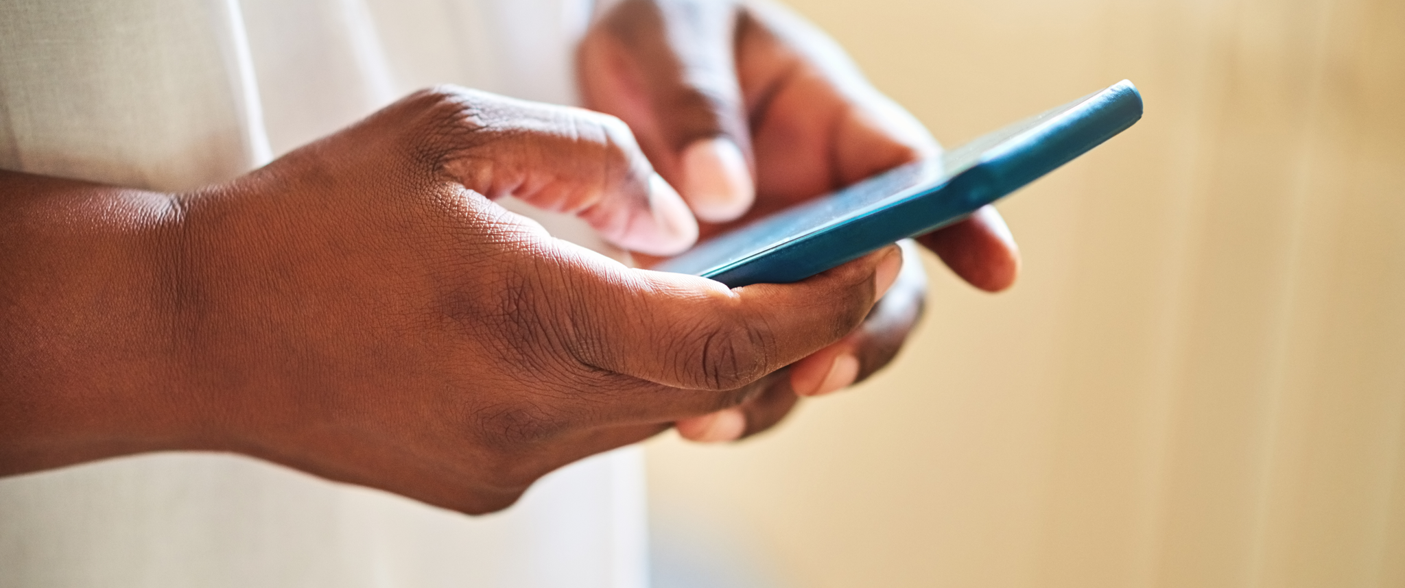 A hand holding a phone
