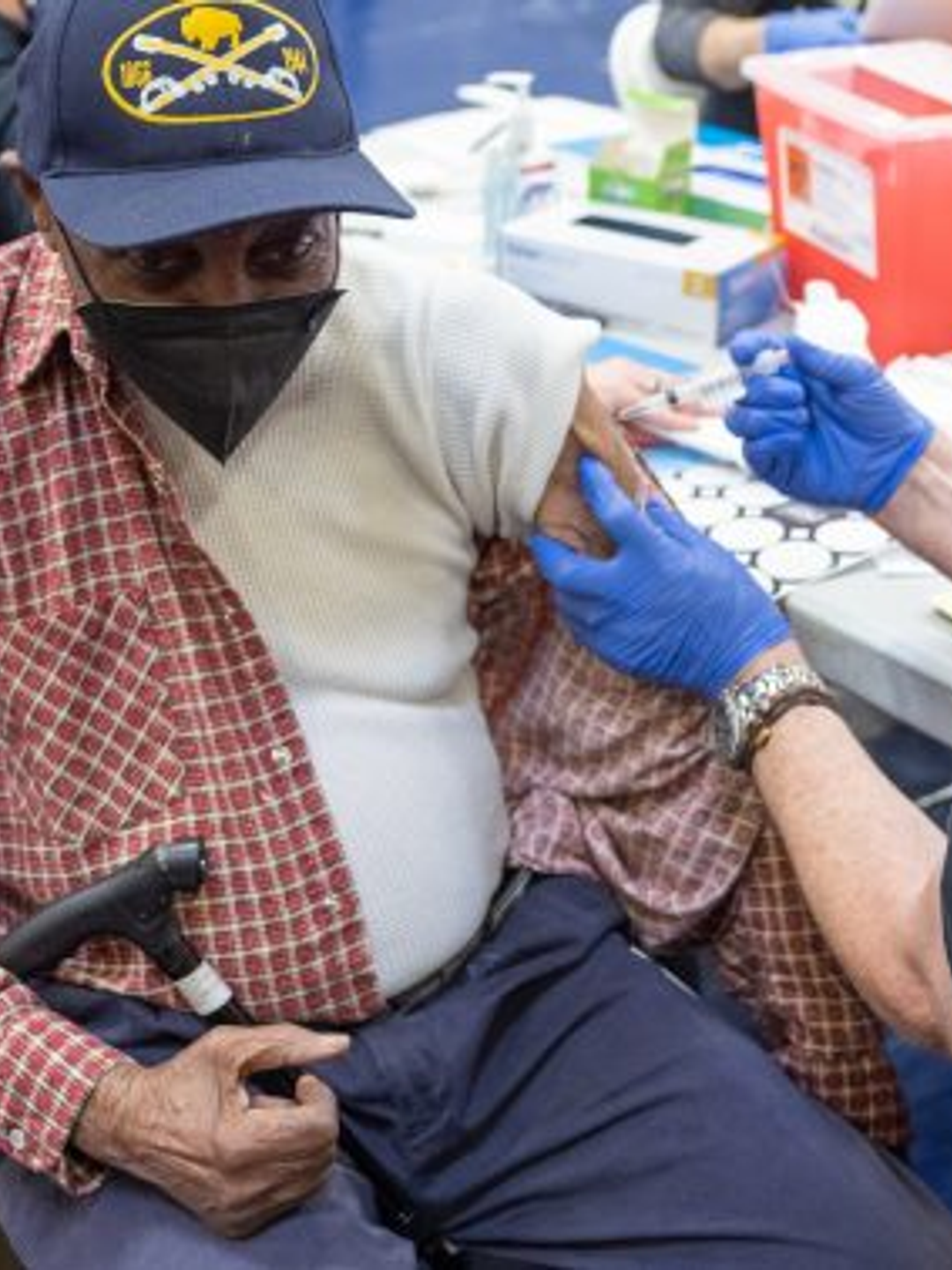 A patient receiving a COVID-19 shot