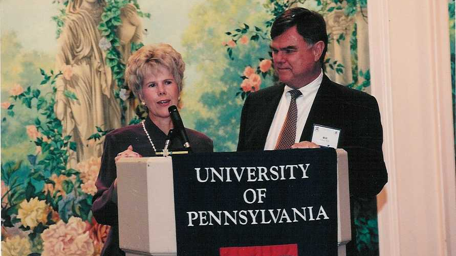 William Kelley and Lois Kelley at a podium in an archival photo