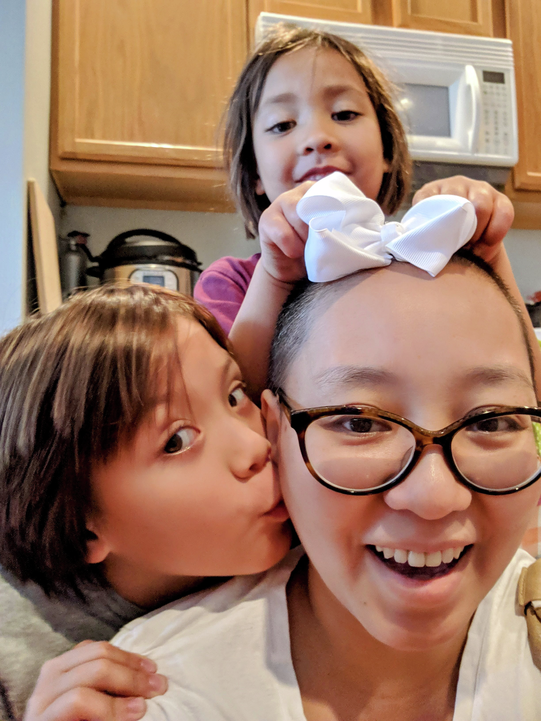 Becky Yu and her two daughters, close up