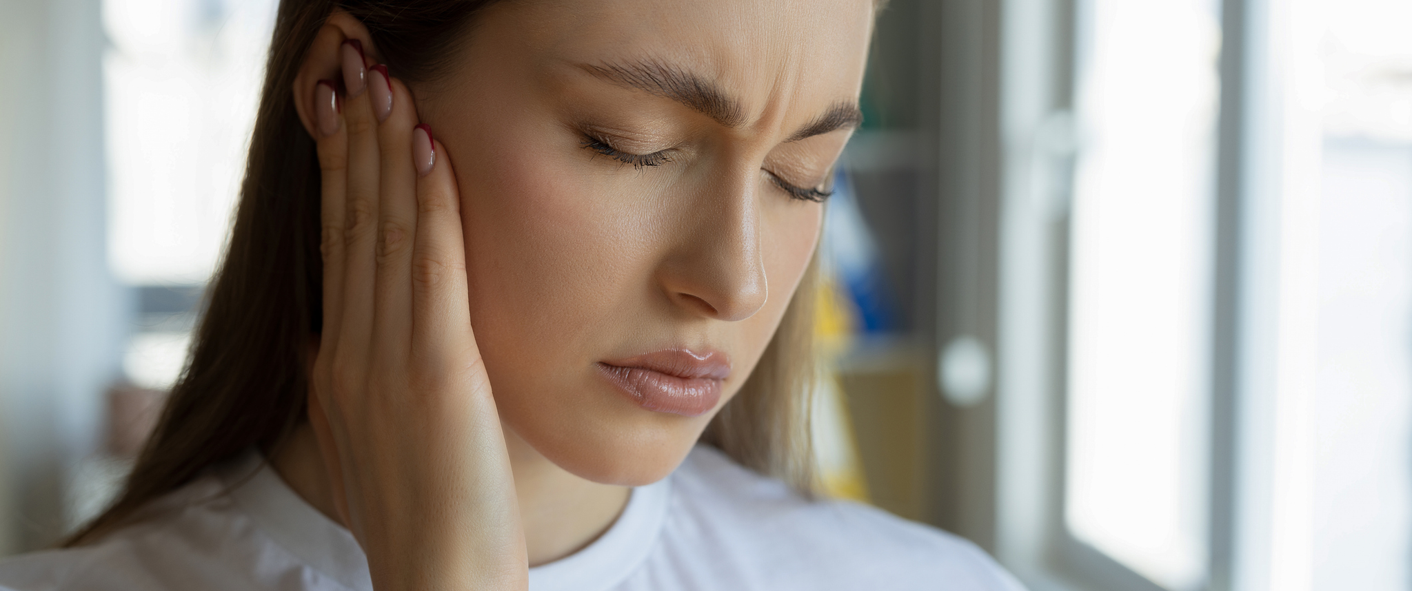Young woman having hearing loss