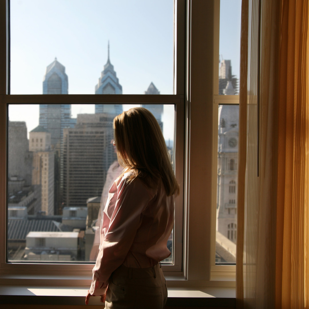 Woman relaxing in her hotel room