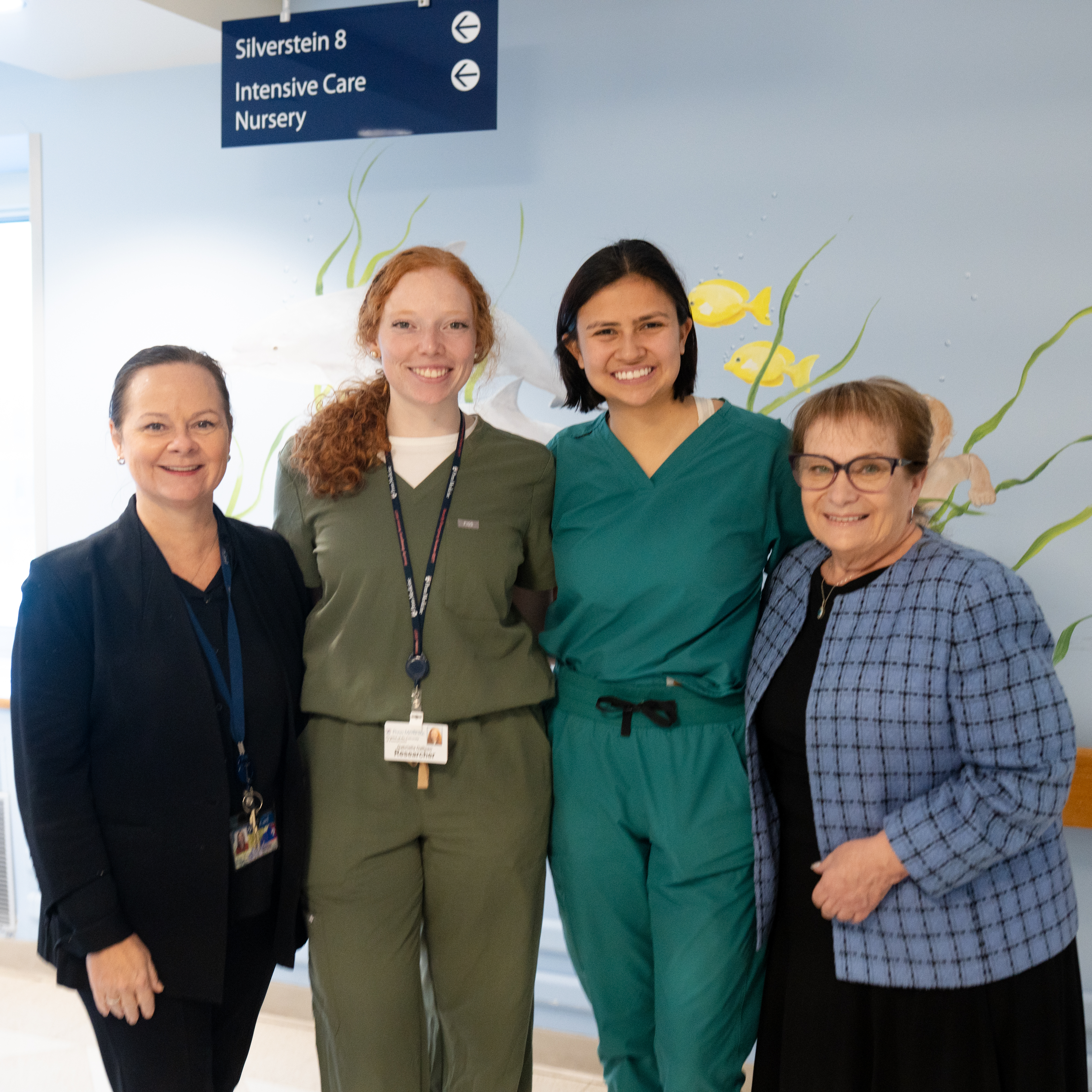 Gabby Daltoso and Sophie Ishiwari, standing in center, with fellow Sonura Beanie researchers at the HUP ICN
