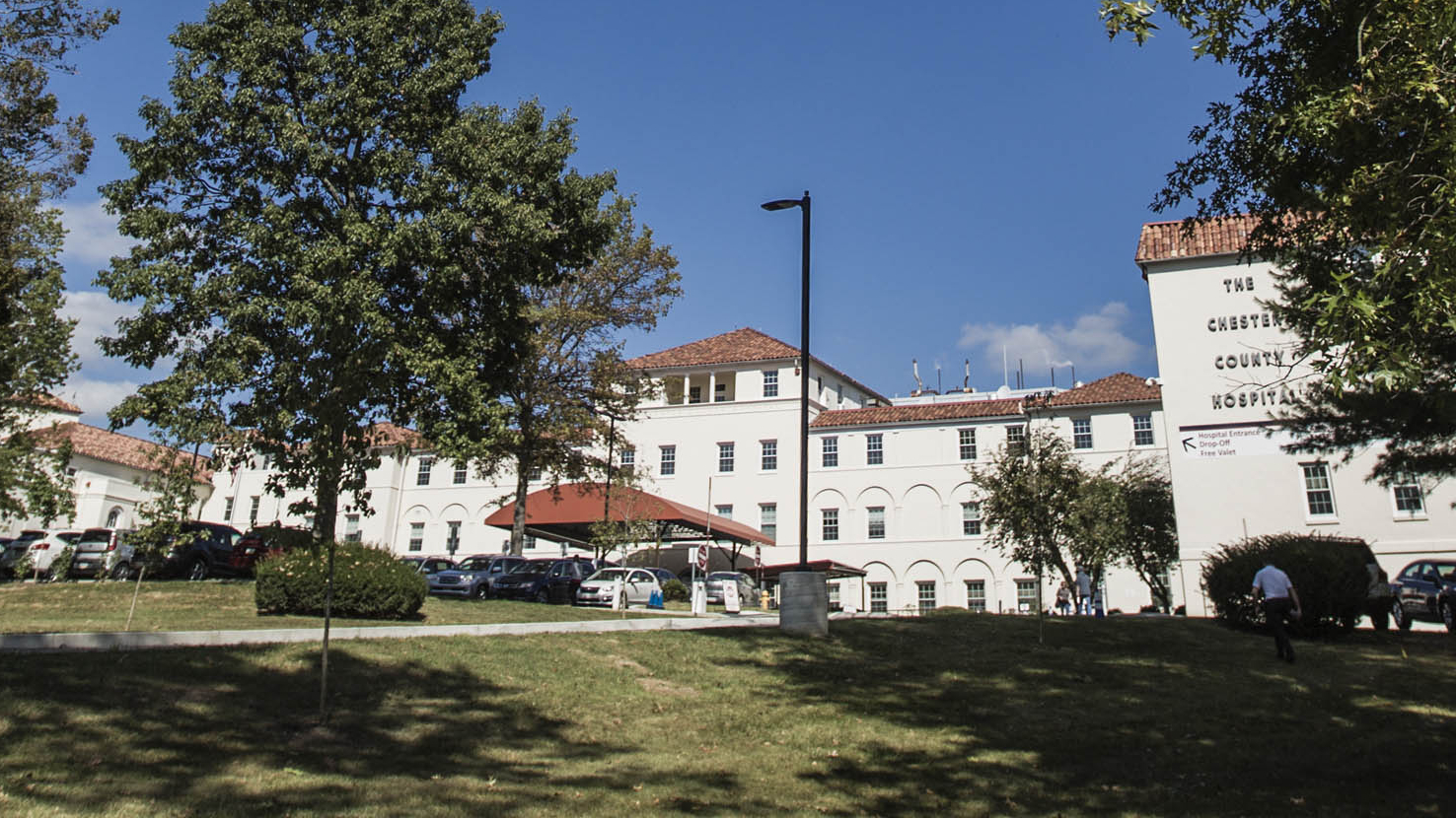 Wide shot of Chester County Hospital building during the day