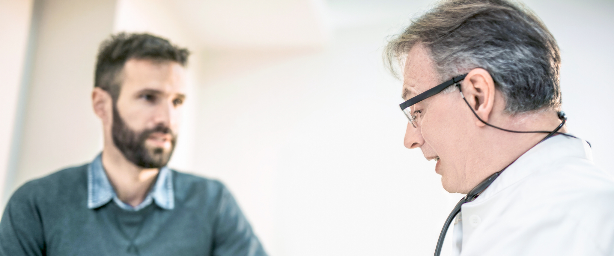 Doctor talking to male patient