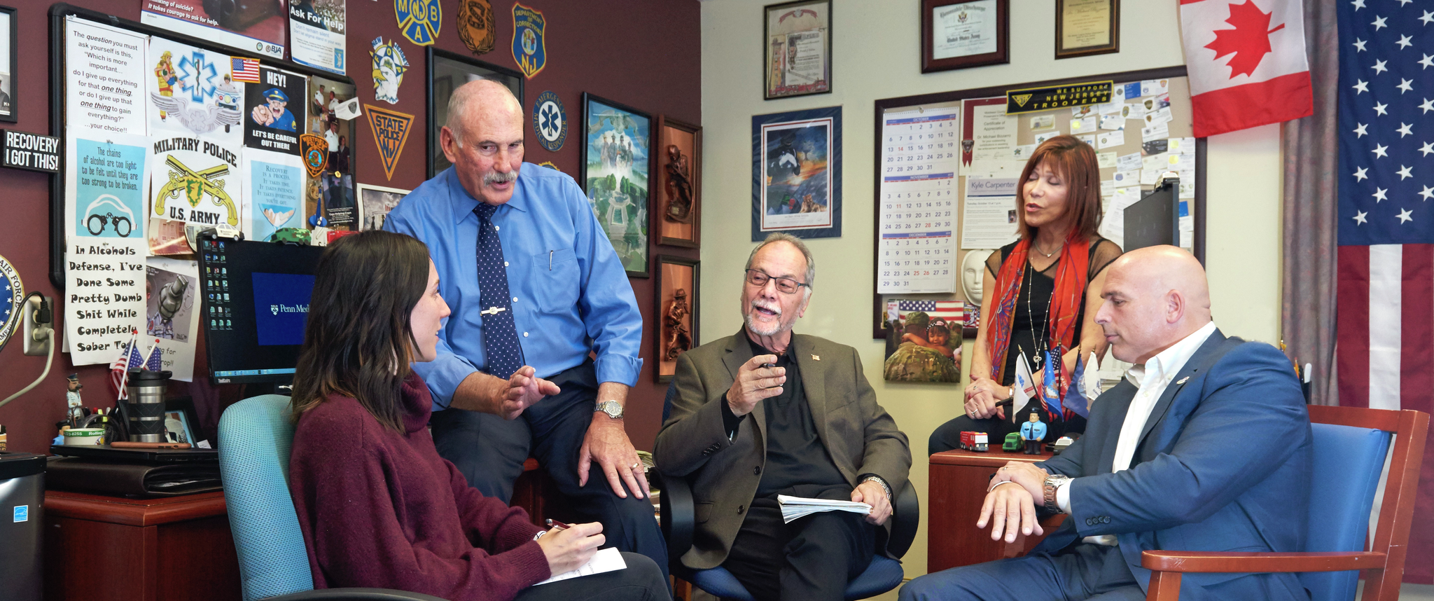 Members of the First Responders Treatment Services team meeting in an office