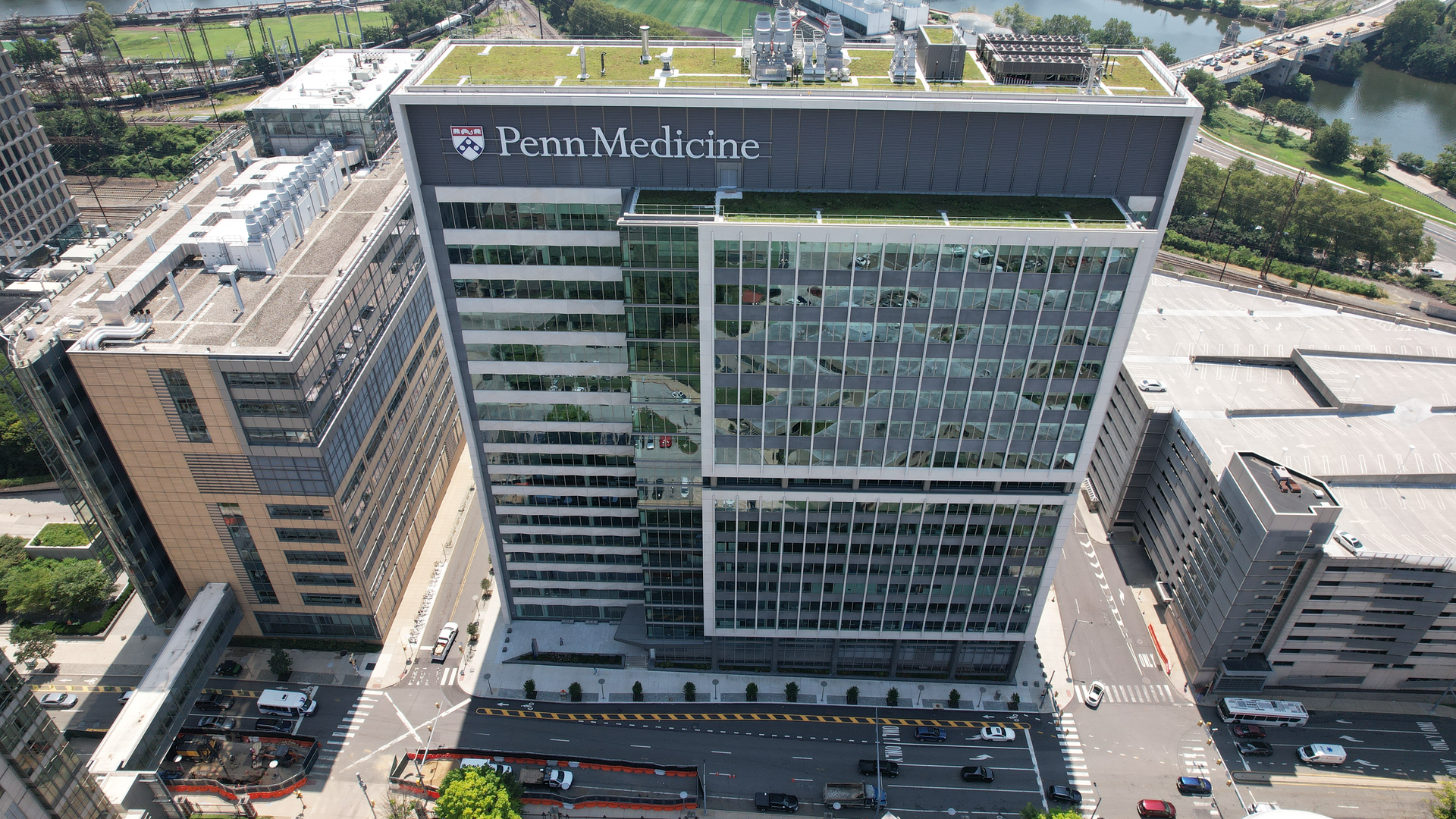 Aerial view of the 3600 Civic Center Boulevard facility, a tall building with Penn Medicine logo