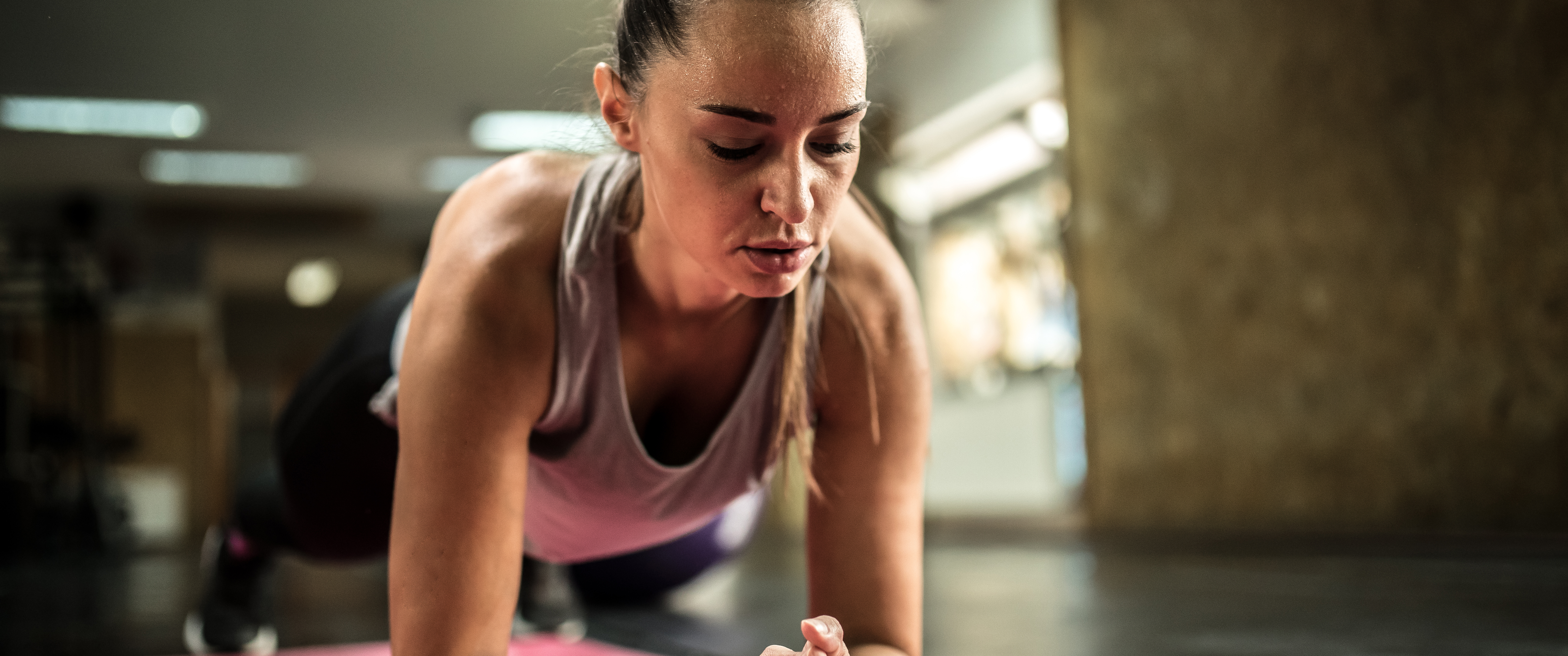 Woman doing a plank on a mat