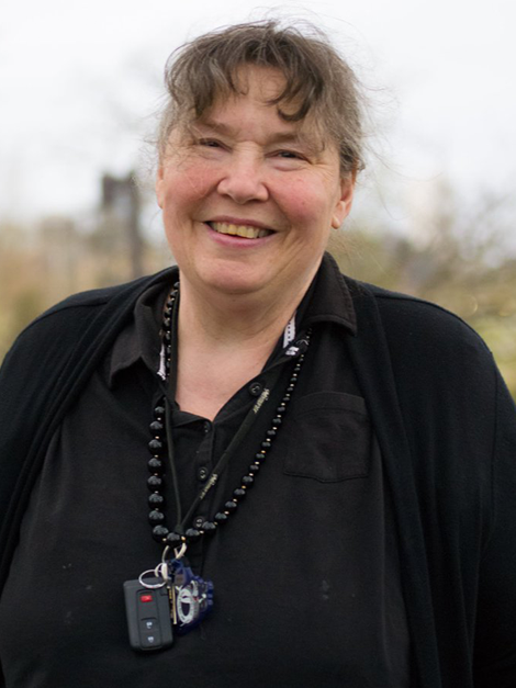Cynthia Olds standing outside, smiling.