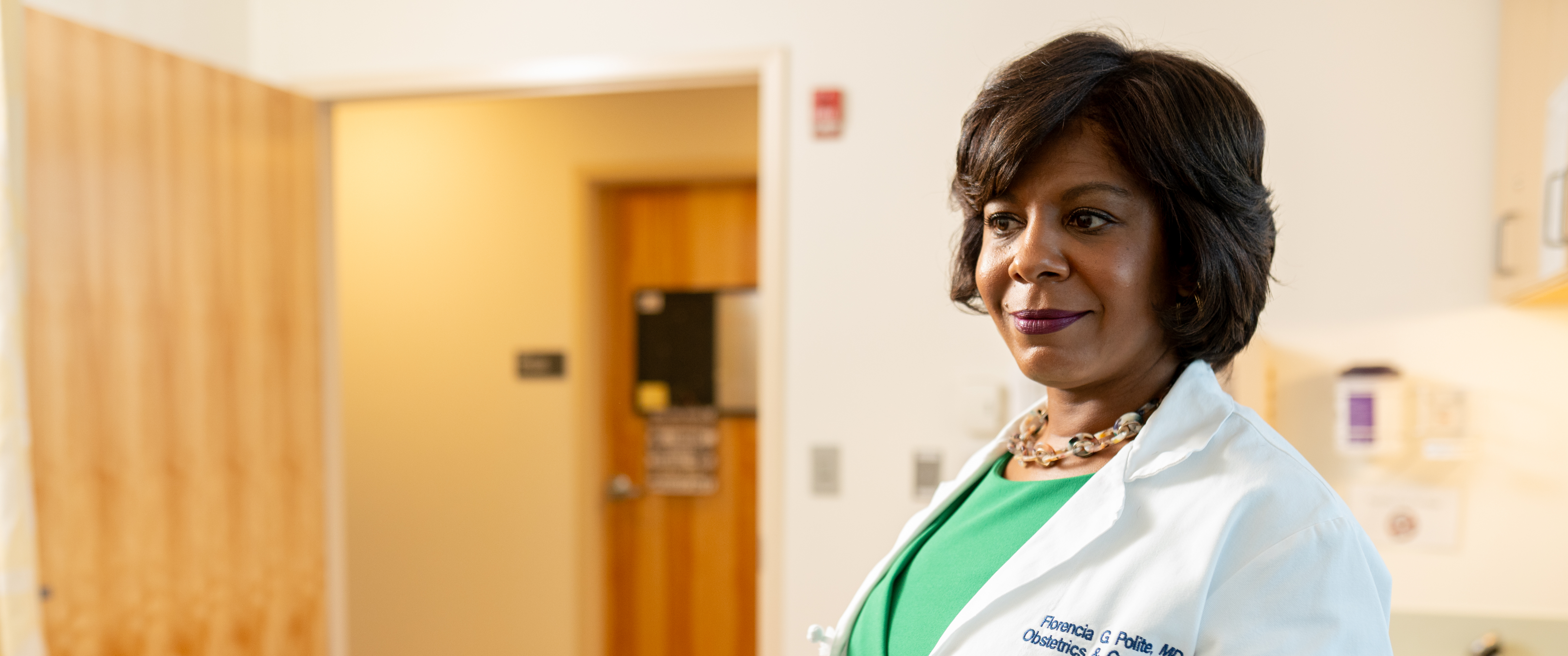 Florencia Polite speaking with a pregnant patient