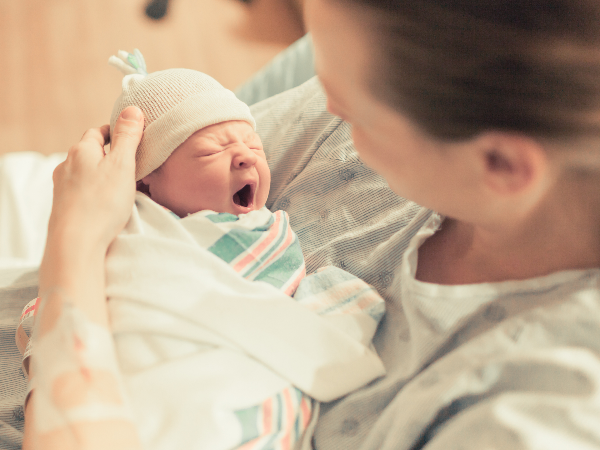 Mother in hospital holding her new born baby
