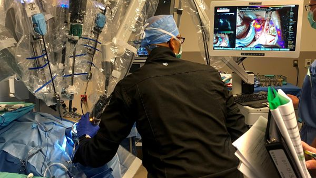Dr.Rajasekaran in scrubs performing surgery in the OR