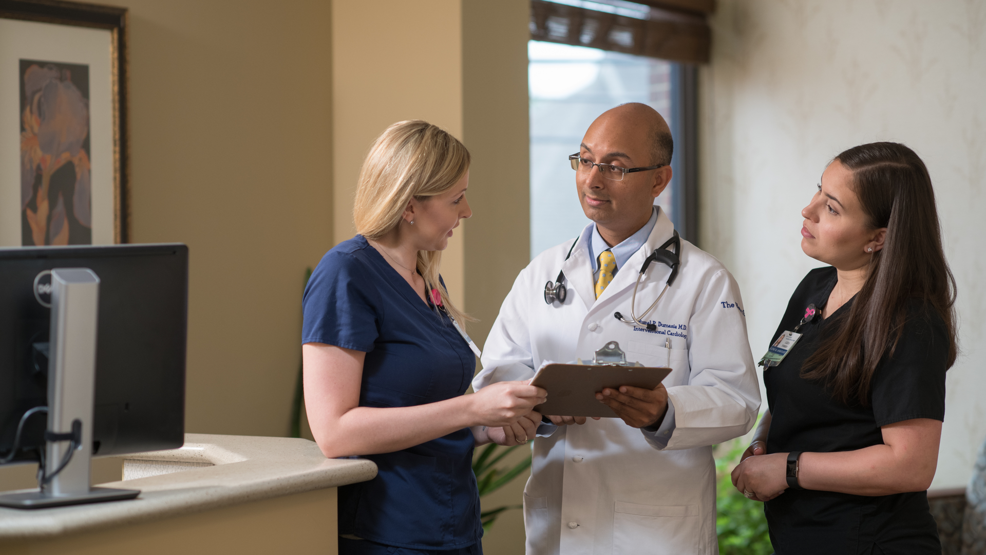 Dr. Rupal Dumasia meets with nurses Alissa Kaufhold and Lizza Torres at the Penn Medicine Heart Group office in Lancaster