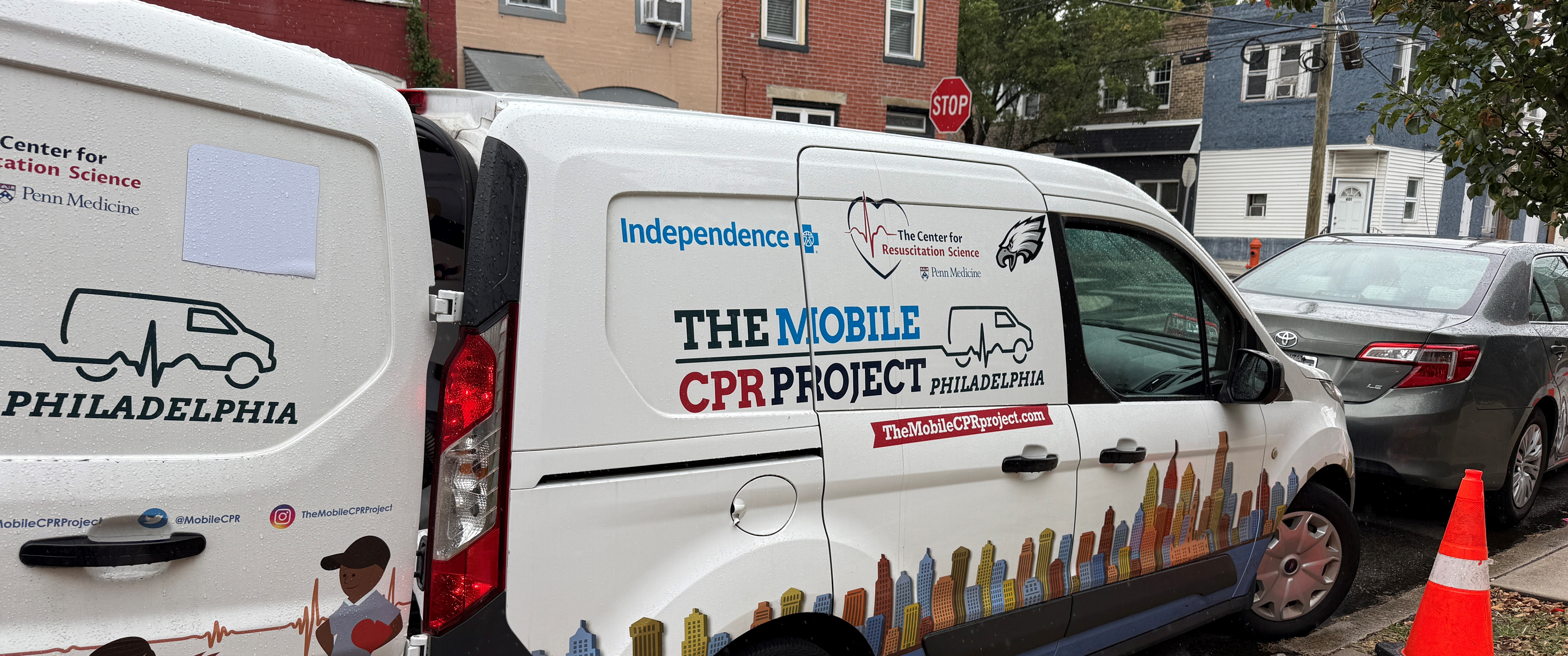 The Mobile CPR Project van parked outside next to the sidewalk.