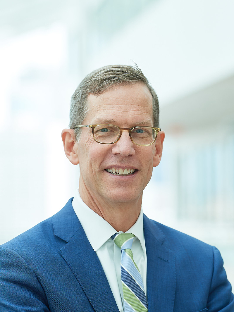 Robert H. Vonderheide smiling in business attire.