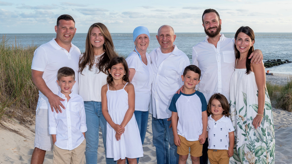 Patient Lynn Oxenberg poses with her children and grandchildren on the beach in Cape May, NJ