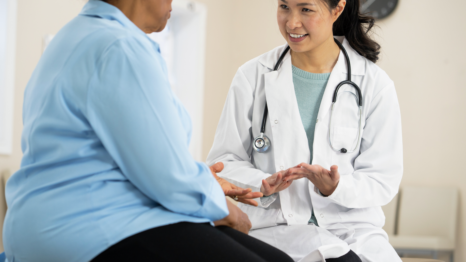 A senior woman of african descent listens to her doctor explain the outcome of her most recent tests