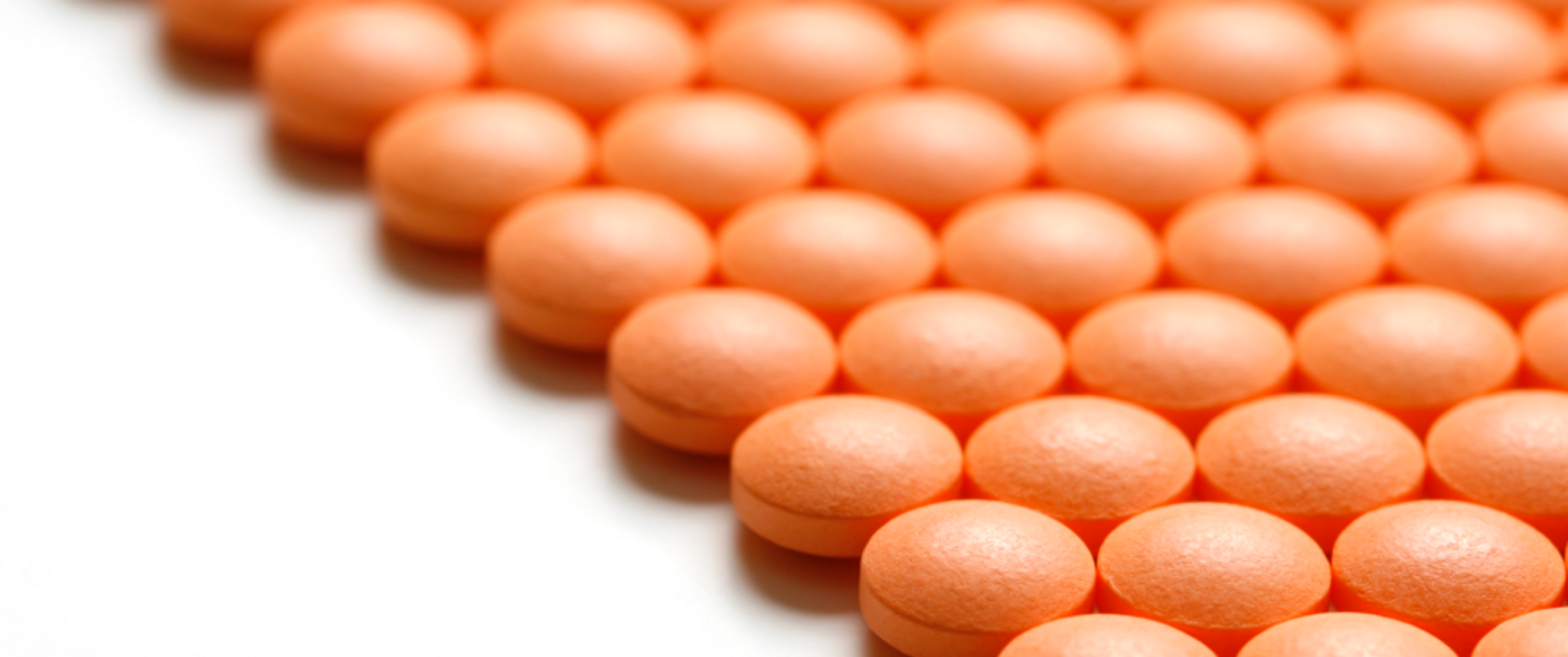 An array of orange pills