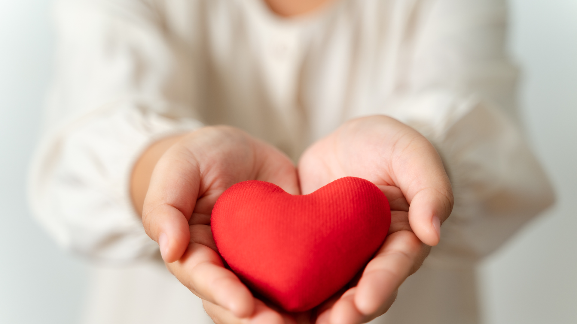 Woman holding red heart