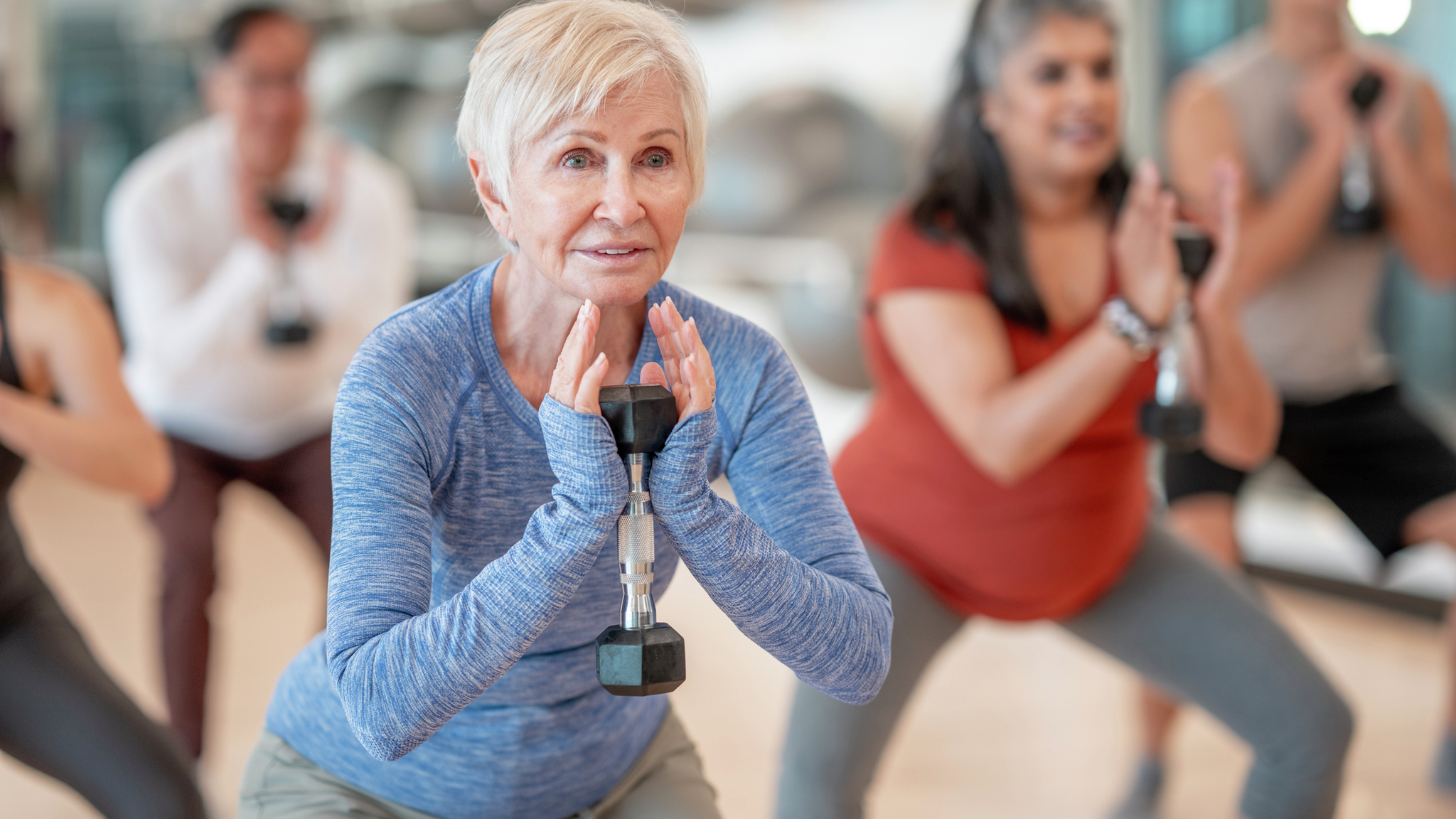 Physical therapist working on patient's hip, performing a manipulation technique.