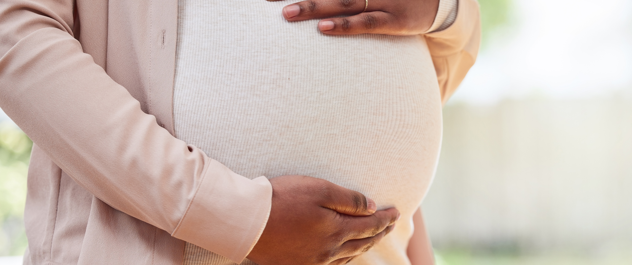 Pregnant woman touching her belly