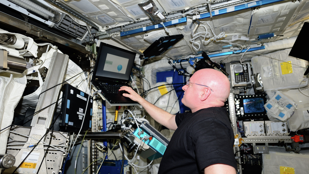 Astronaut checking components in space