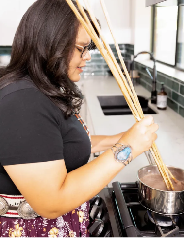 Navajo Nation dietitian Denee Bex preparing traditional Navajo foods for program participants