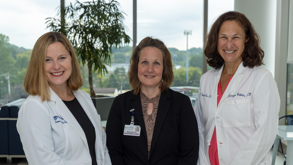 Katherine Costantini, Melissa Welsh, and Dr. Jennifer Cohen stand smiling for a group photo.