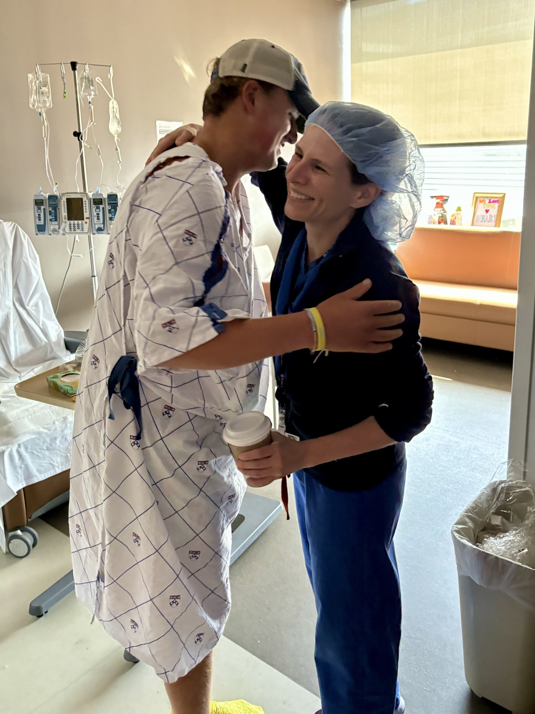 Kevin hugging his surgeon Kendall Lawrence in hospital room