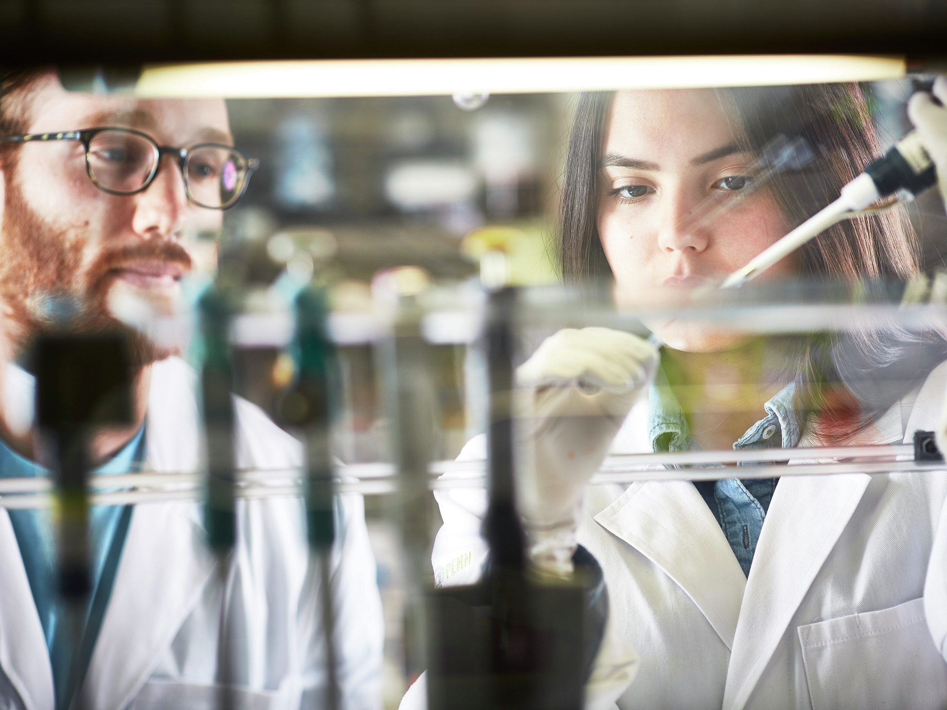 Penn Medicine proton therapy researchers in lab 