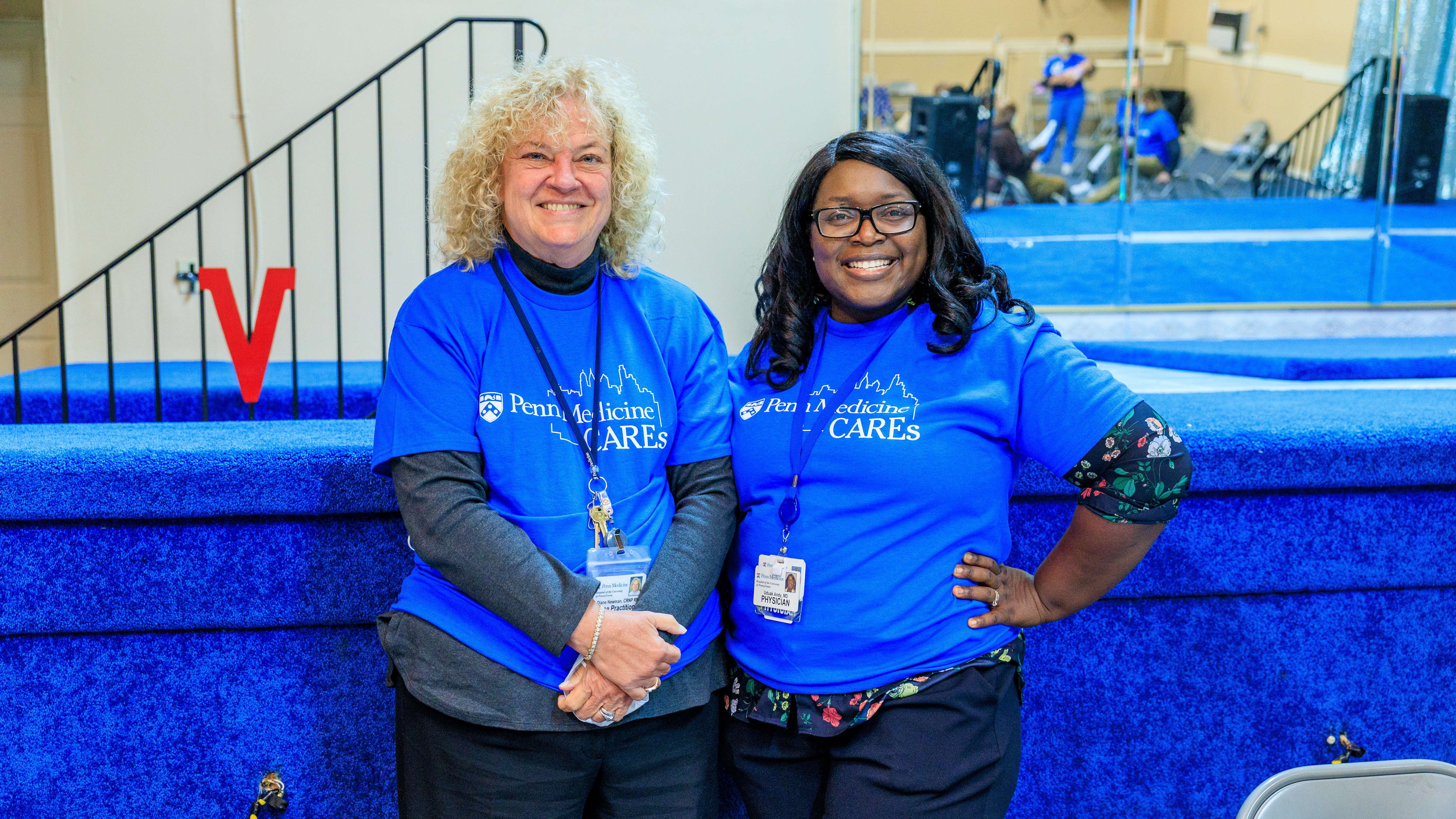 Two Penn Medicine employees smiling at the Active Senior Day Out event at the Victory Christian Center