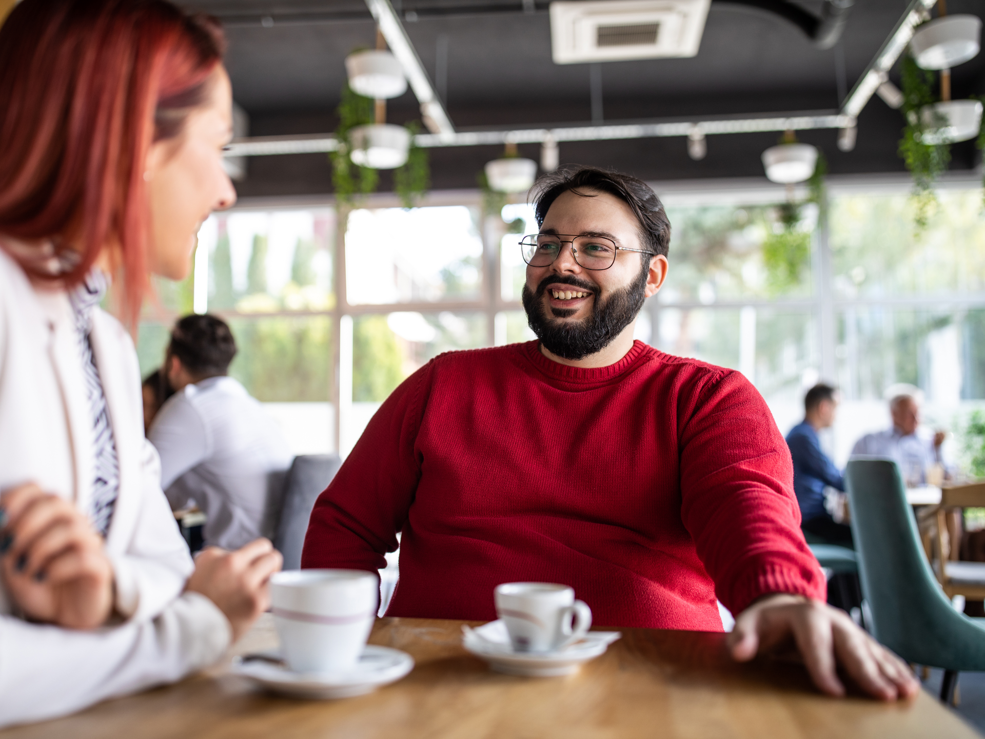 Young couple having fun on a date in cafe