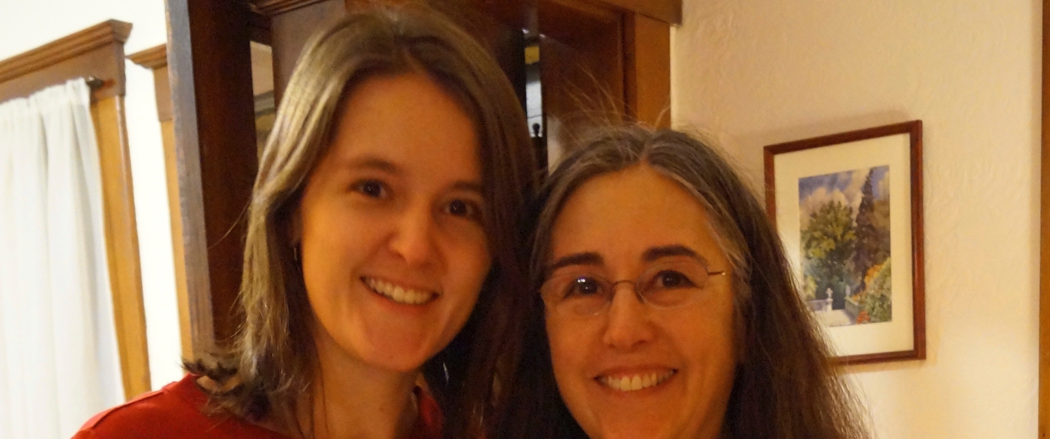 Dr. Katherine Hicks-Courant and her mother, wearing red shirts