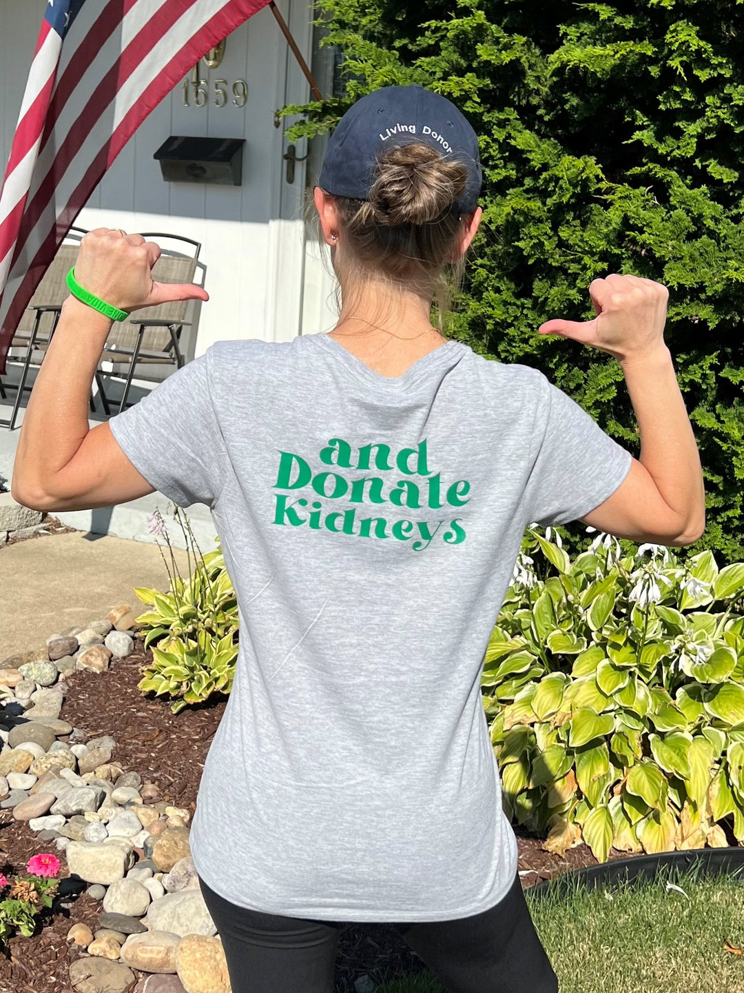 Joanie Shappell shows off the back of her t-shirt, which reads, "and donate kidneys".jpg