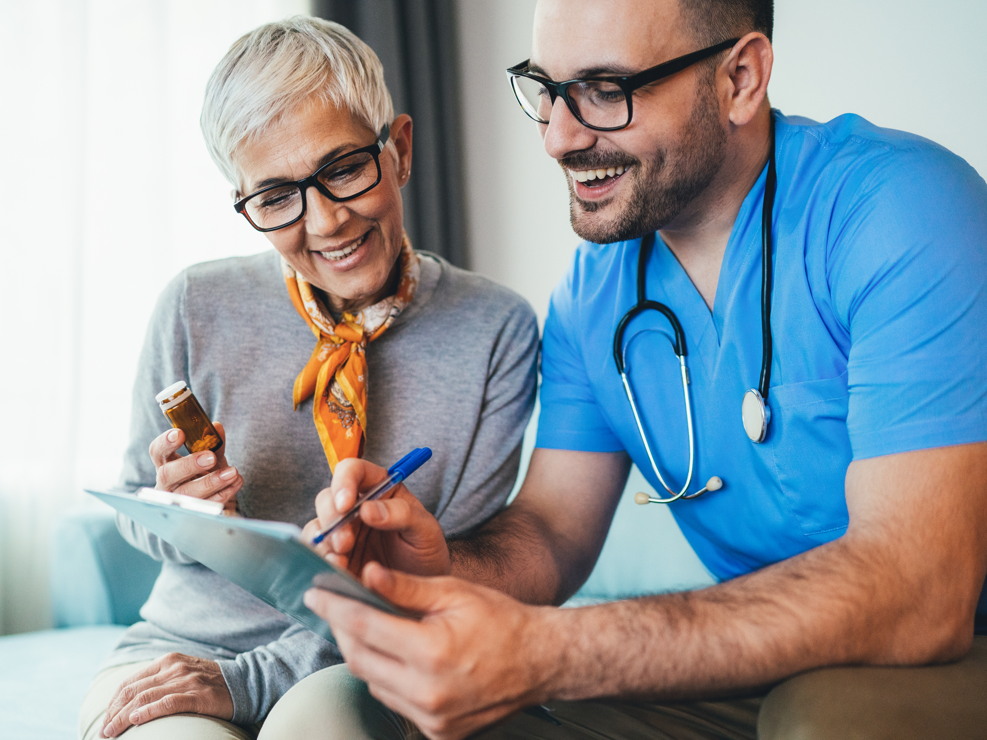 Young smiling doctor is consulting a modern senior woman 