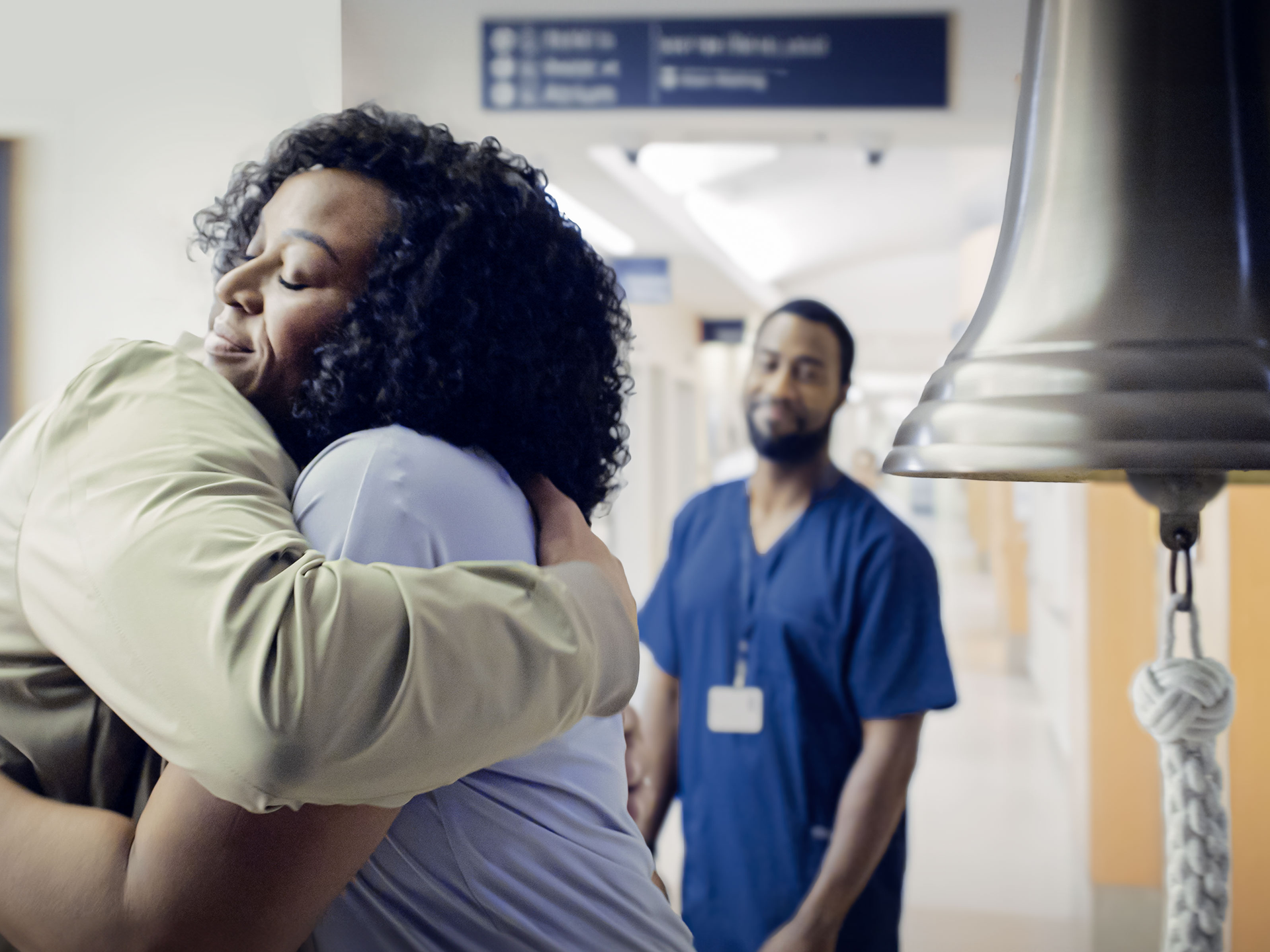 Cancer survivor embraces loved one at Abramson Cancer Center