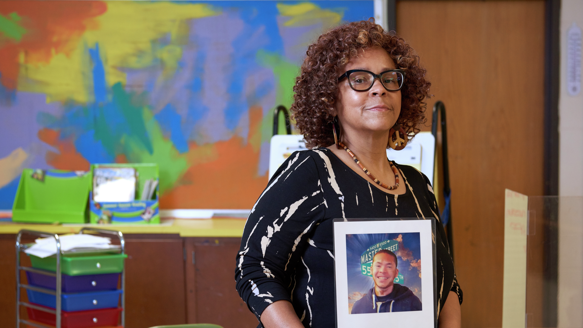Cheryl Graham-Seay holding a photo of her son, a victim of gun violence in Philadelphia