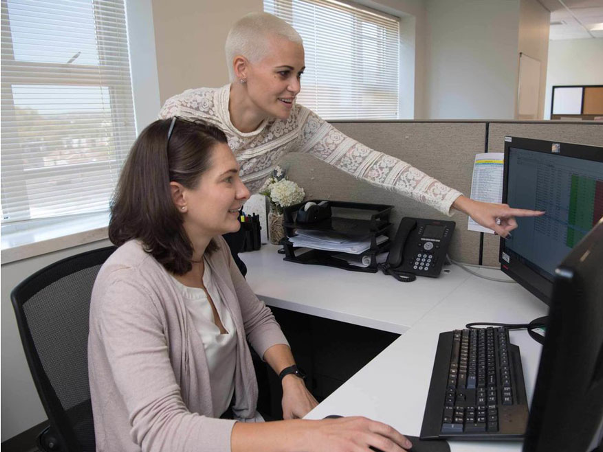 Researchers at a computer