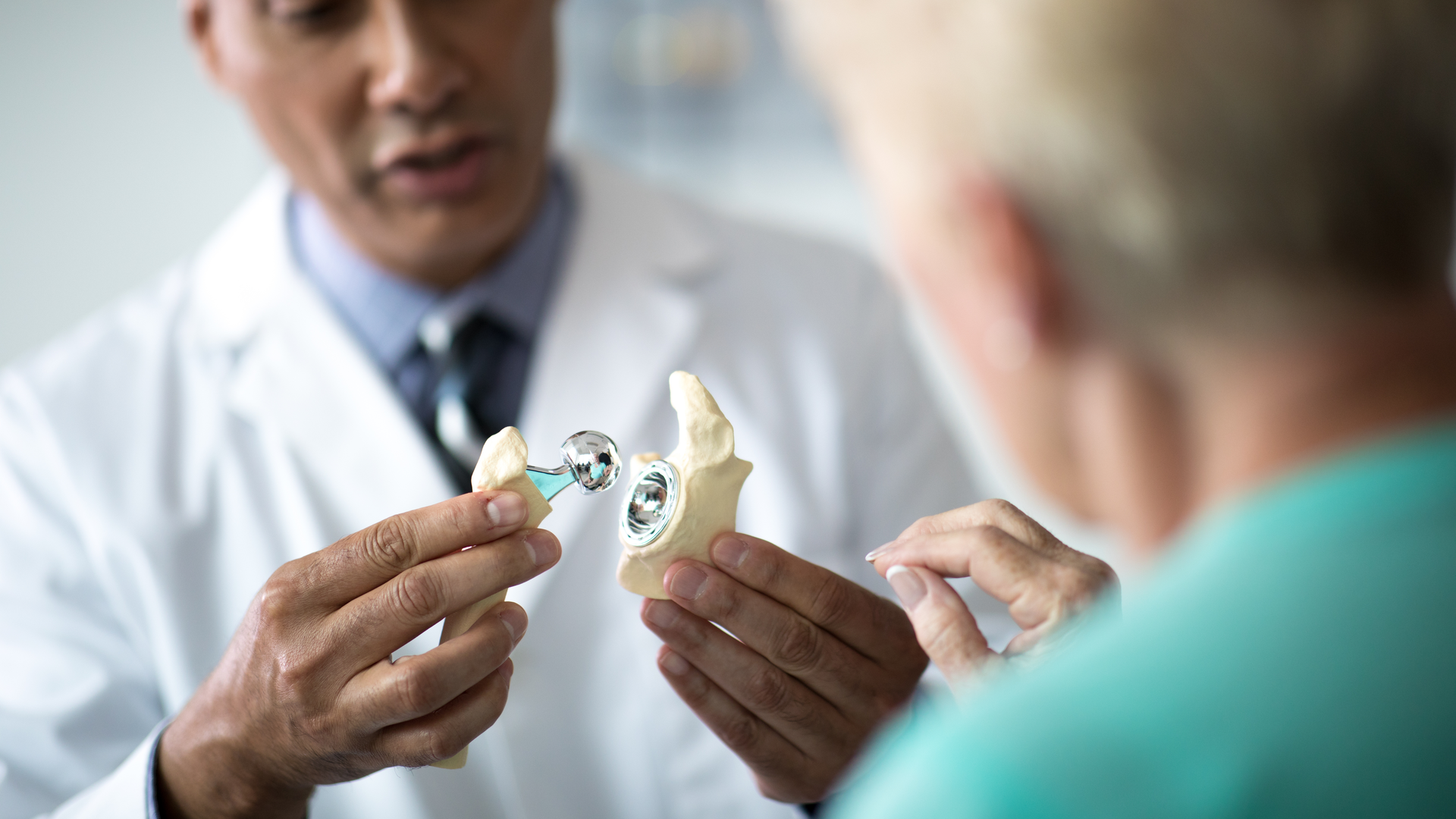 Penn Medicine orthopaedic doctor demonstrates hip replacement for patient