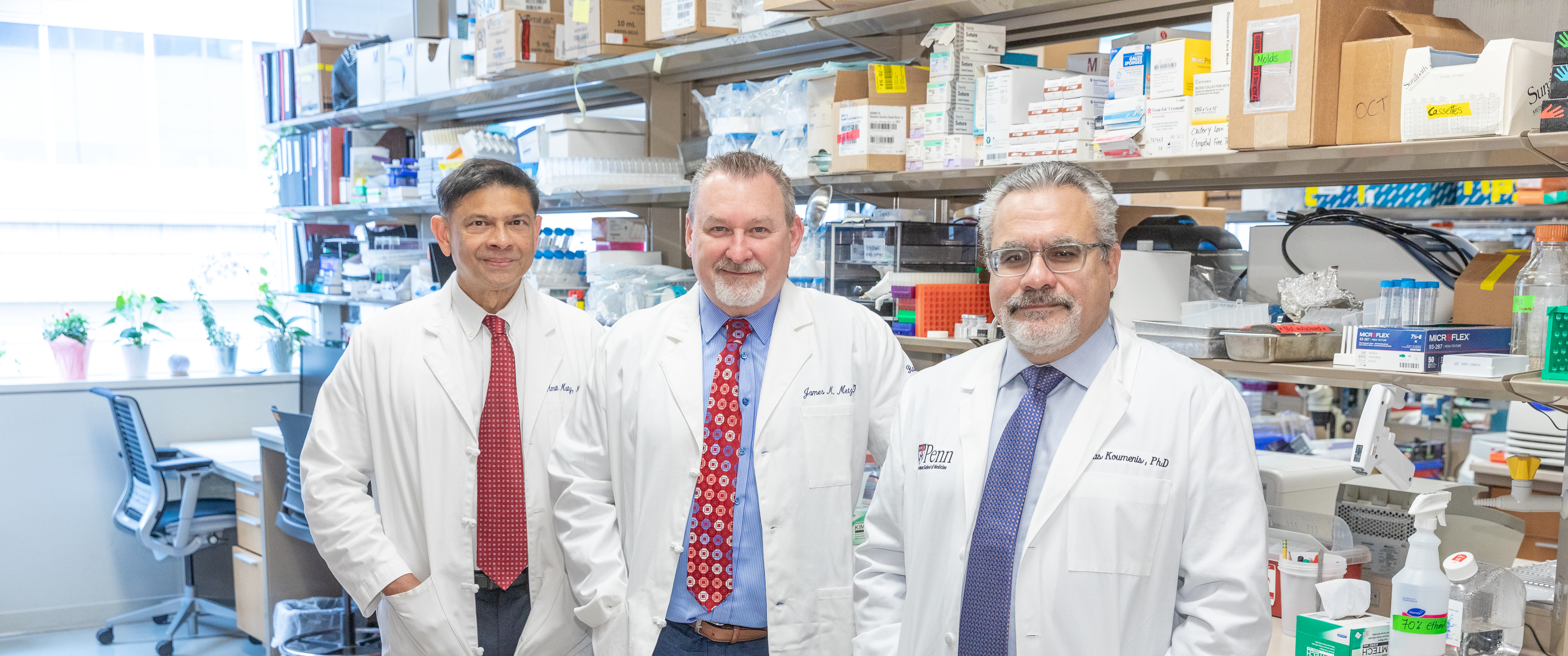 Group photo of Amit Maity, MD, PhD, James Metz, MD, and Constantinos Koumenis, PhD, in a research lab