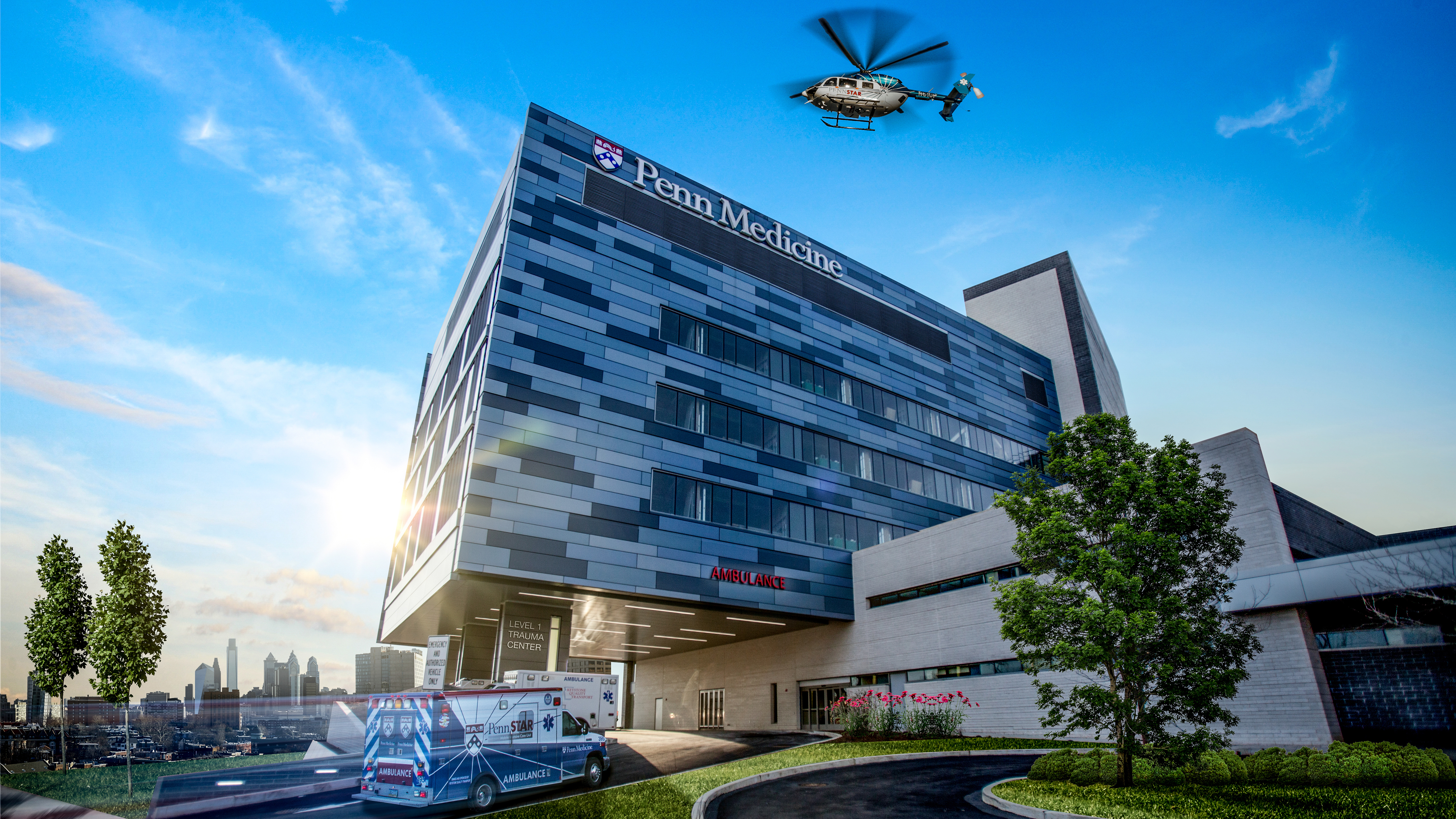 An ambulance and PennStar helicopter arrive at Penn Presbyterian Medical Center's Level 1 Trauma Center